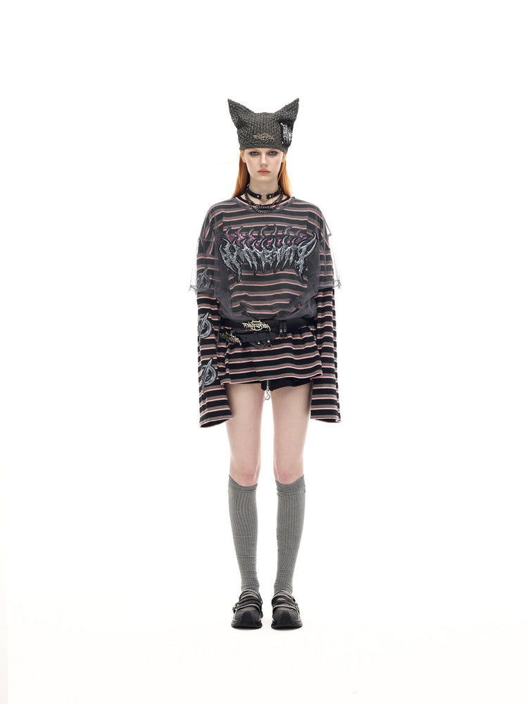 PINKSPINK DEVILCAT distressed cat-ear knit beanie in black — full-length modeled view showing the pointed ears