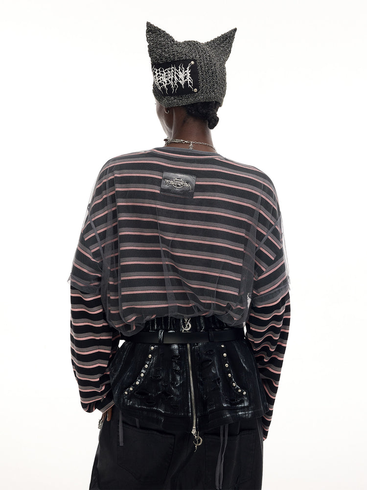 PINKSPINK DEVILCAT distressed cat-ear knit beanie in black — back modeled view with a striped tee