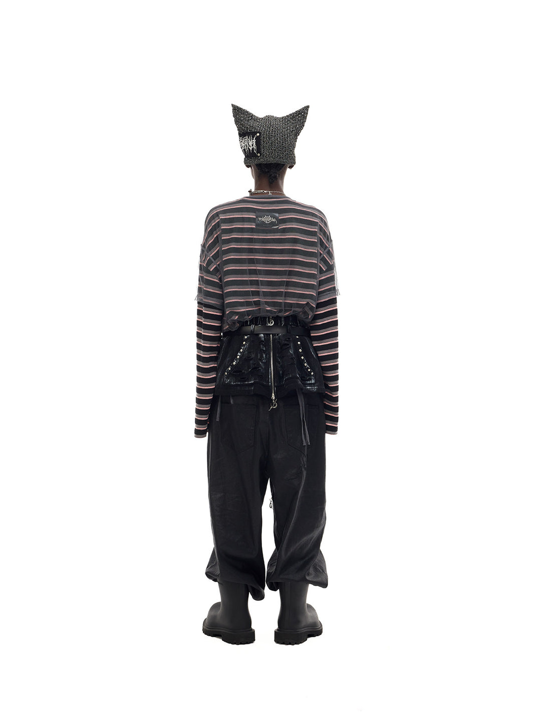 PINKSPINK DEVILCAT distressed cat-ear knit beanie in black — full-length back view with trousers