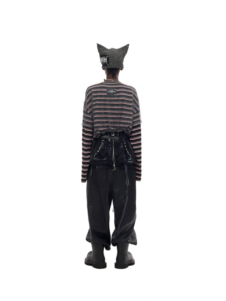 PINKSPINK DEVILCAT distressed cat-ear knit beanie in black — full-length back view with trousers