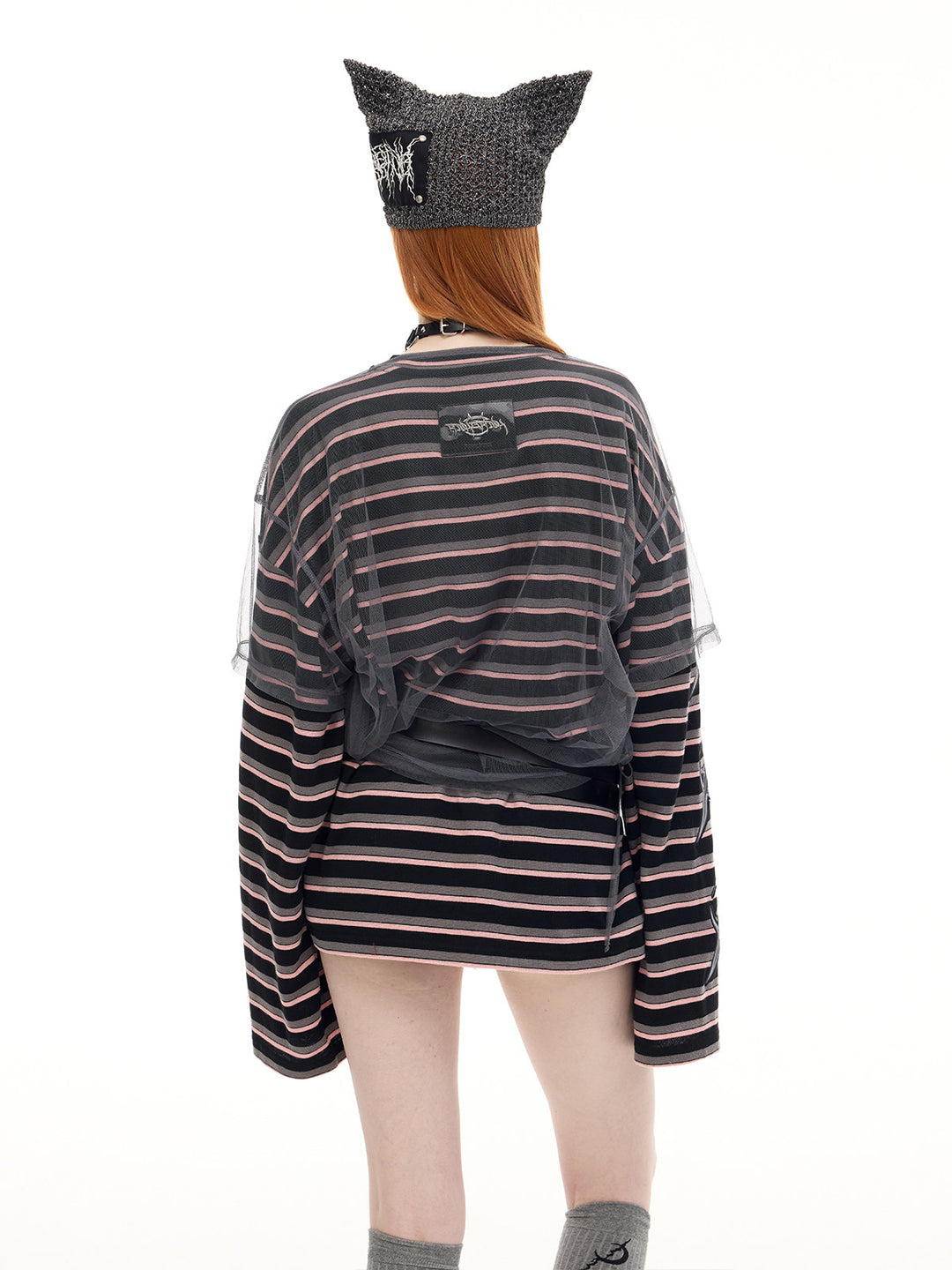 PINKSPINK DEVILCAT distressed cat-ear knit beanie in black — back three-quarter modeled outfit view