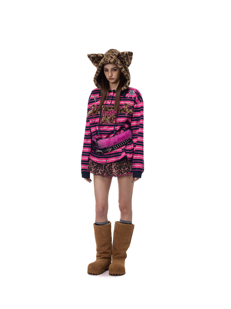PINKSPINK ELECTRIC MOON double-strap studded faux-fur leather belt in black and pink — full-length three-quarter modeled view with a striped hoodie