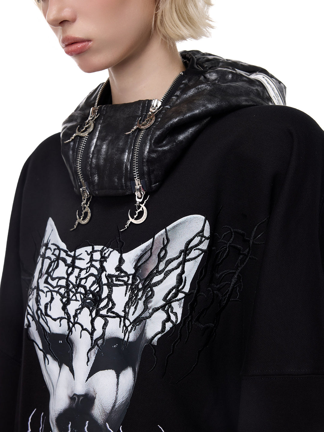 PINKSPINK ELECTRIC MOON metallic double-zip balaclava in metallic black — close-up worn down around the neck with zipper hardware visible