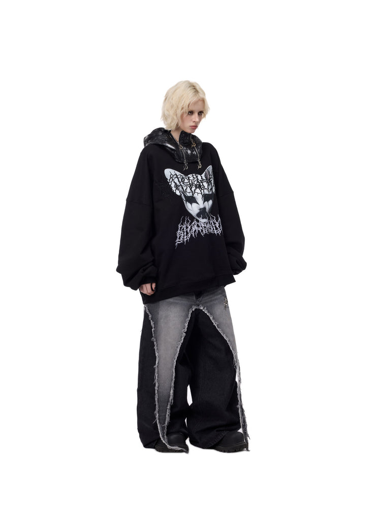 PINKSPINK ELECTRIC MOON metallic double-zip balaclava in metallic black — full-length three-quarter modeled outfit with graphic sweatshirt