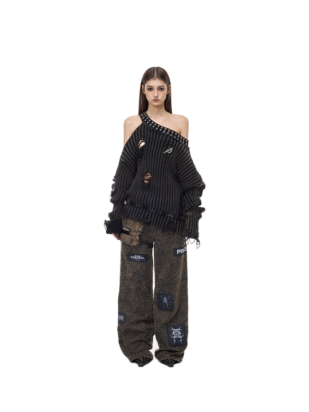 PINKSPINK ELECTRIC MOON distressed studded cold-shoulder sweater in washed black — full-length front modeled view with wide-leg trousers