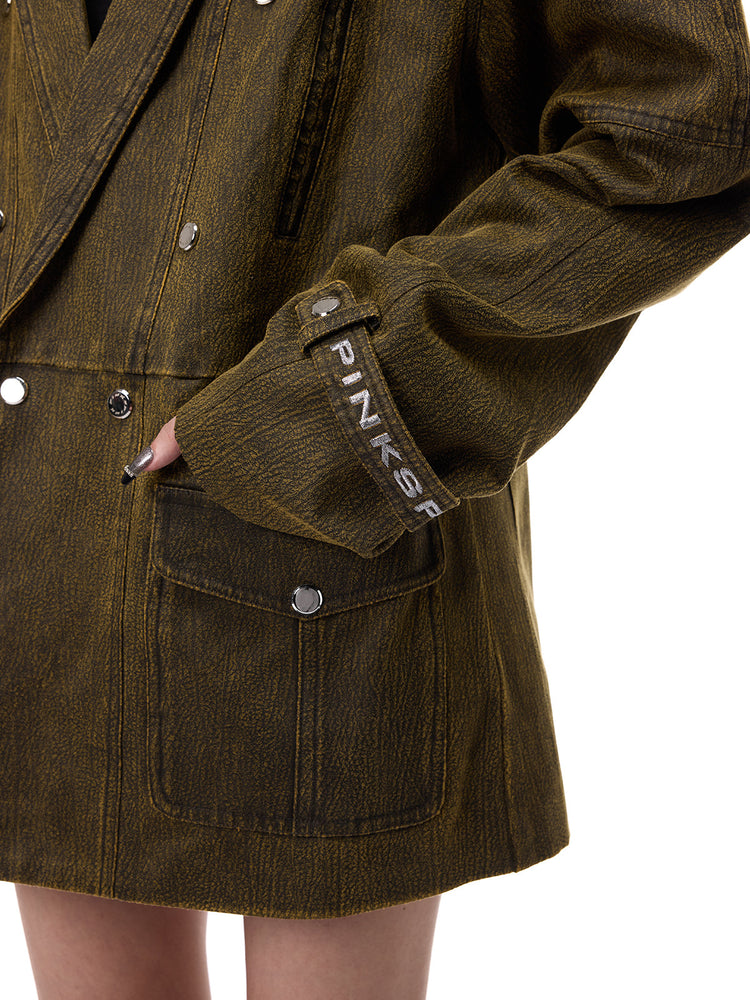 PINKSPINK ELECTRIC MOON sculpted-shoulder washed blazer in olive brown — close-up of the branded cuff tab and patch pocket