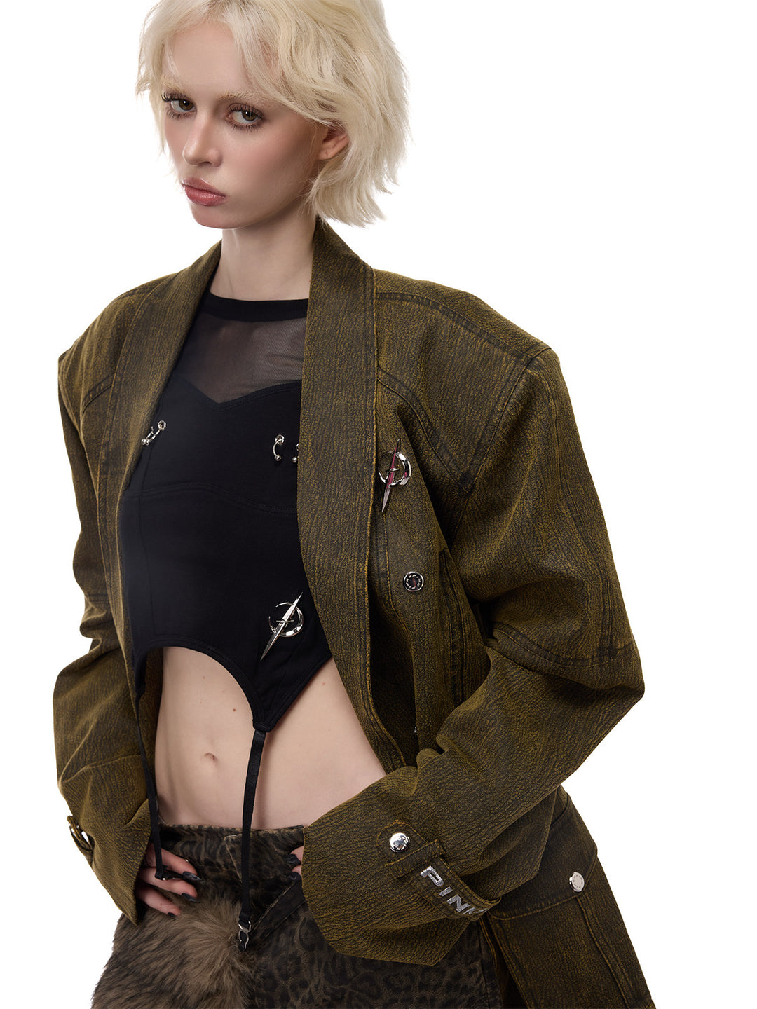 PINKSPINK ELECTRIC MOON sculpted-shoulder washed blazer in olive brown — angled close-up of the open front and textured finish