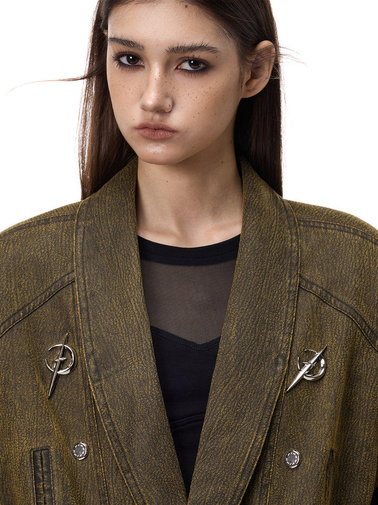 PINKSPINK ELECTRIC MOON sculpted-shoulder washed blazer in olive brown — close-up of the collar and ELECTRIC MOON hardware