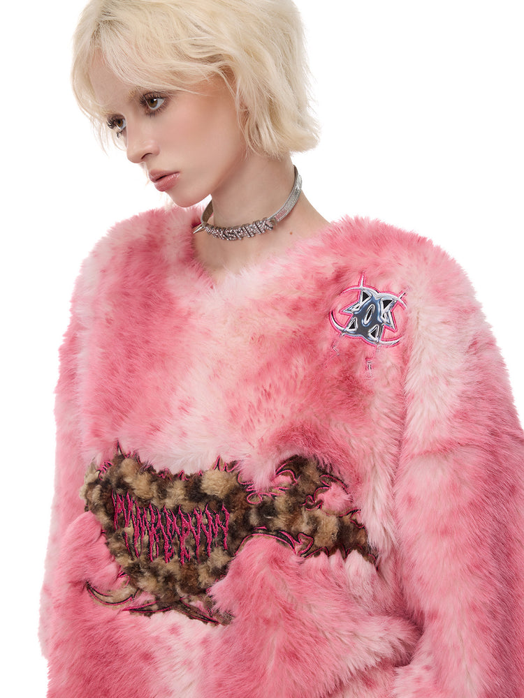 PINKSPINK ELECTRIC MOON thorn-heart faux-fur jersey in pink — angled close-up of the leopard-pattern thorn-heart motif and chest emblem