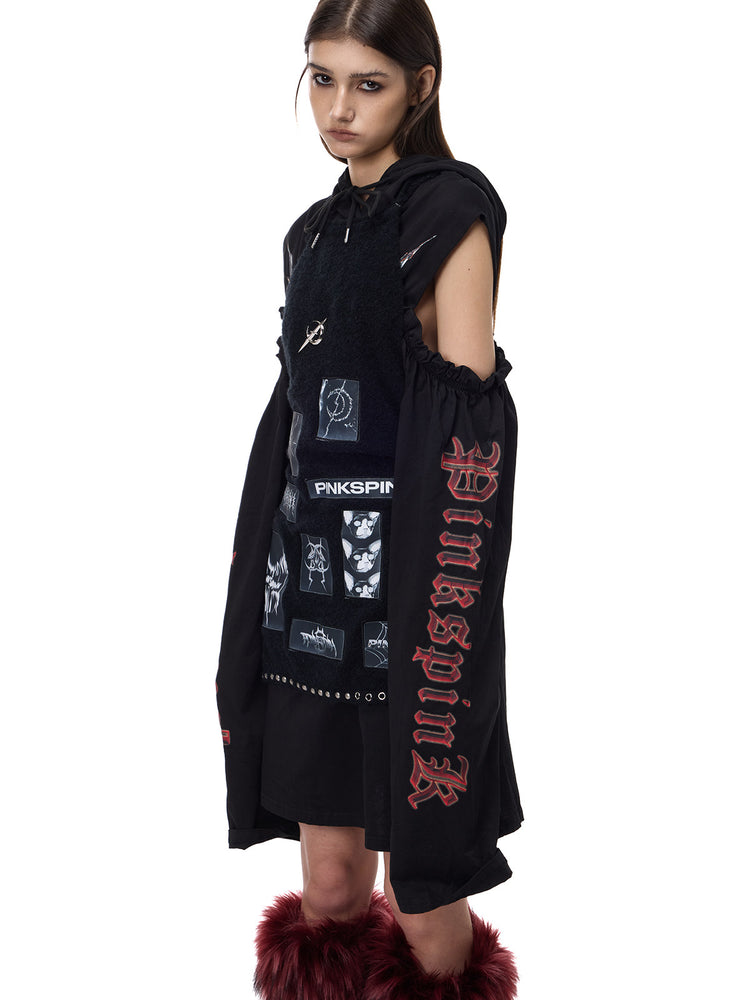 PINKSPINK ELECTRIC MOON cold-shoulder hooded sweatshirt dress in black — three-quarter modeled view showing sleeve print under a separate vest