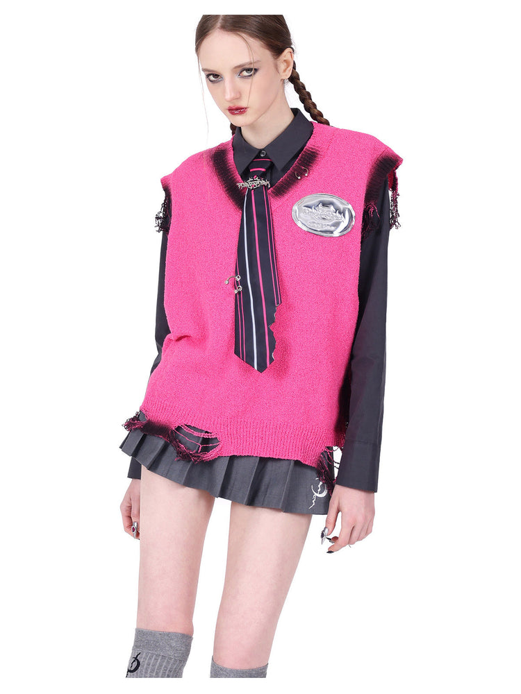 PINKSPINK REBEL detachable layered pleated skirt in gray — close modeled view of the short skirt hem styled with a pink vest