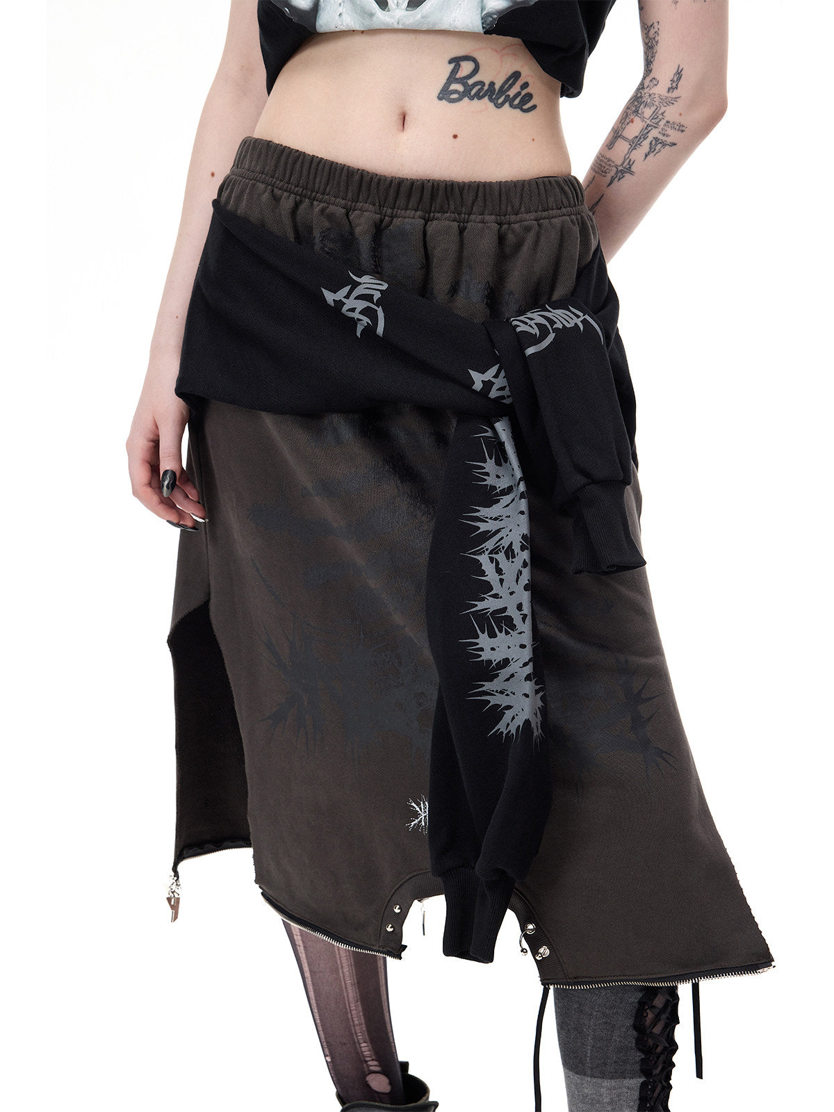 PINKSPINK REMAKE convertible thorn skirt in black gray — close angled front view of the skirt’s tied sleeves and thorn print