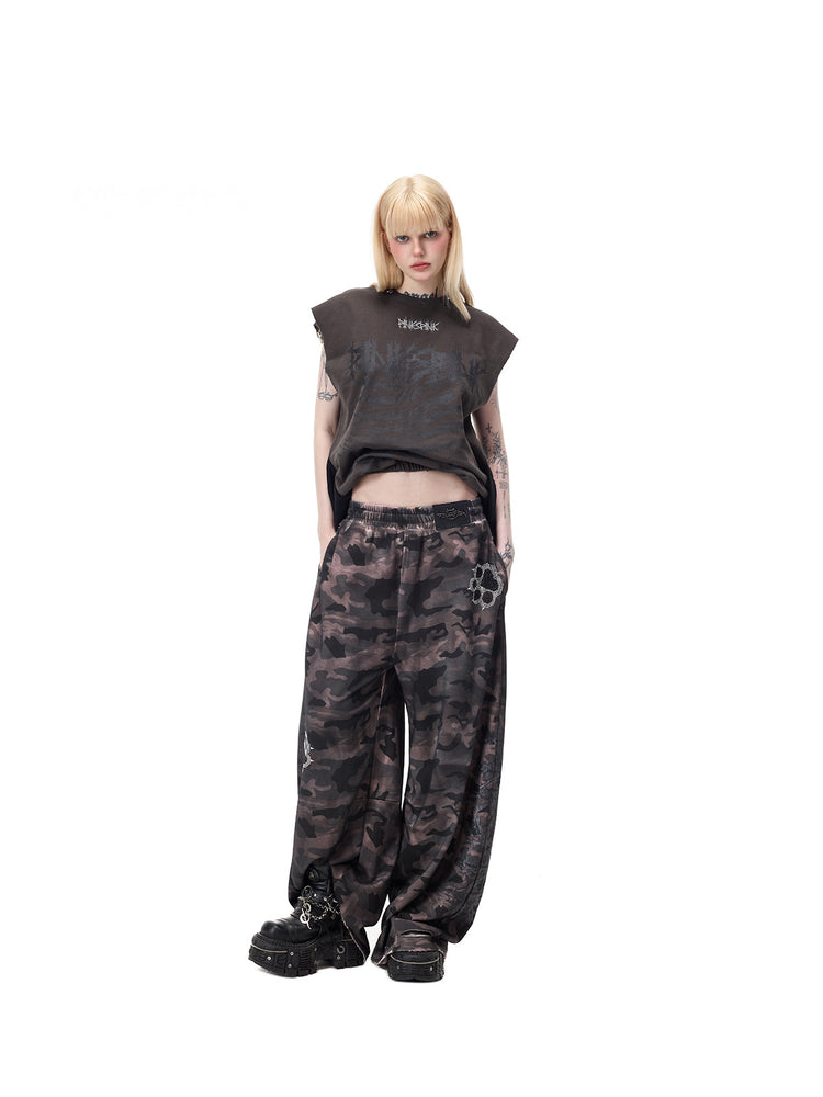 PINKSPINK REMAKE convertible thorn skirt in black gray — angled full-length modeled view in tank configuration, styled with separate camouflage trousers