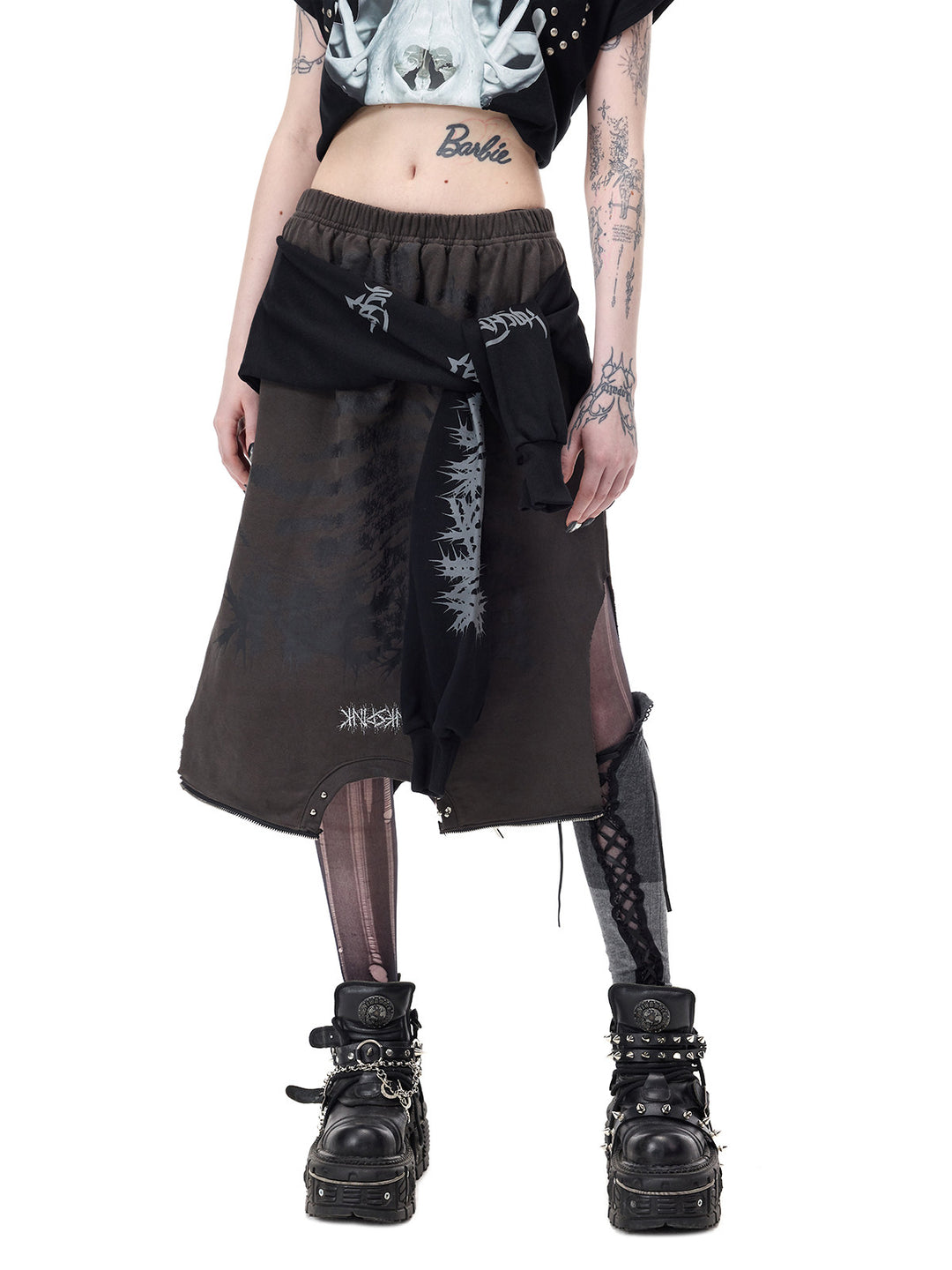 PINKSPINK REMAKE convertible thorn skirt in black gray — angled front modeled view showing the skirt’s elastic waist, thorn graphics and side opening