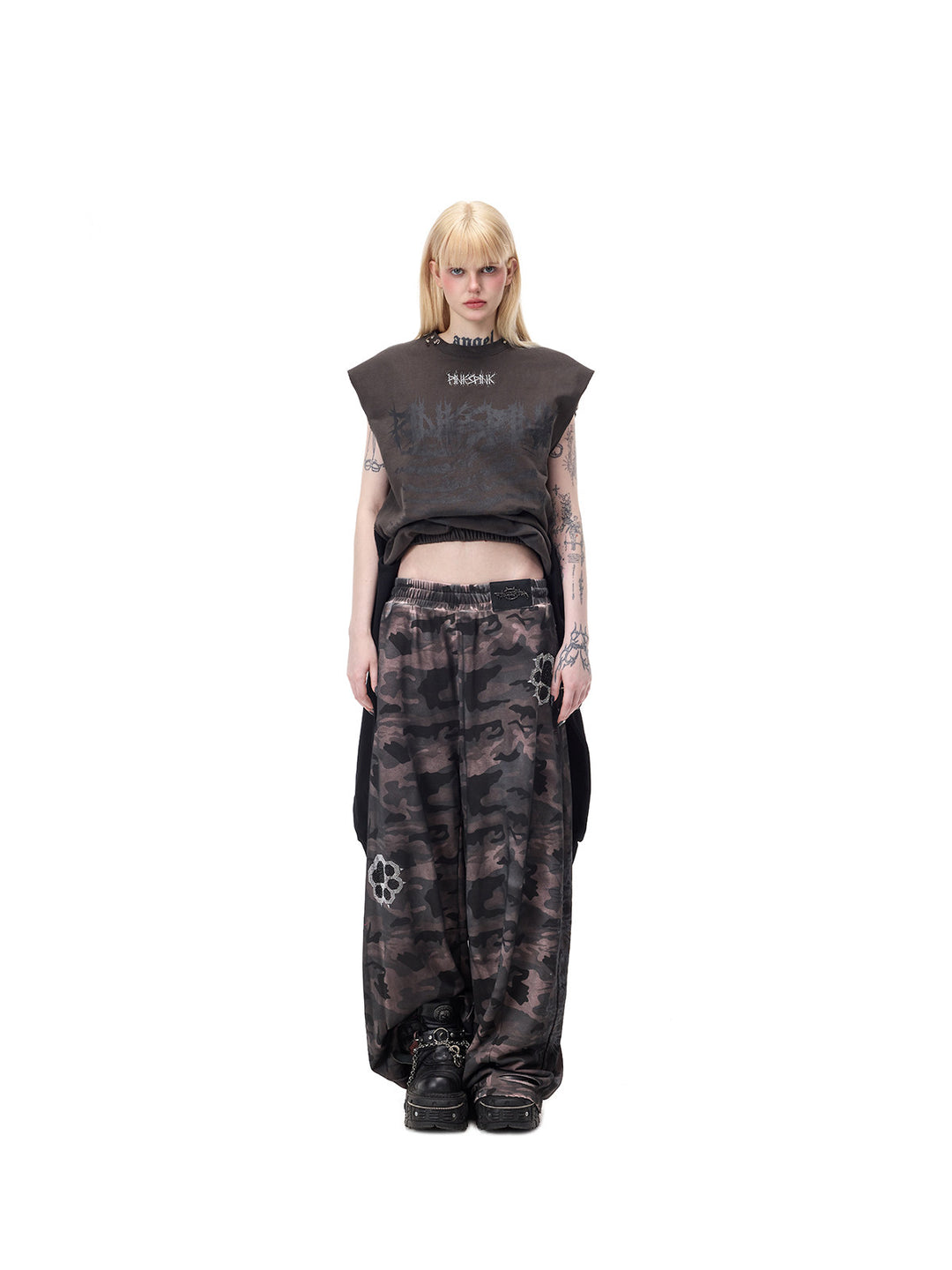 PINKSPINK REMAKE convertible thorn skirt in black gray — full-length front modeled view in tank configuration, styled with separate camouflage trousers
