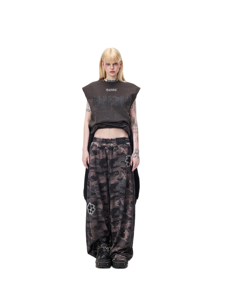 PINKSPINK REMAKE convertible thorn skirt in black gray — full-length front modeled view in tank configuration, styled with separate camouflage trousers