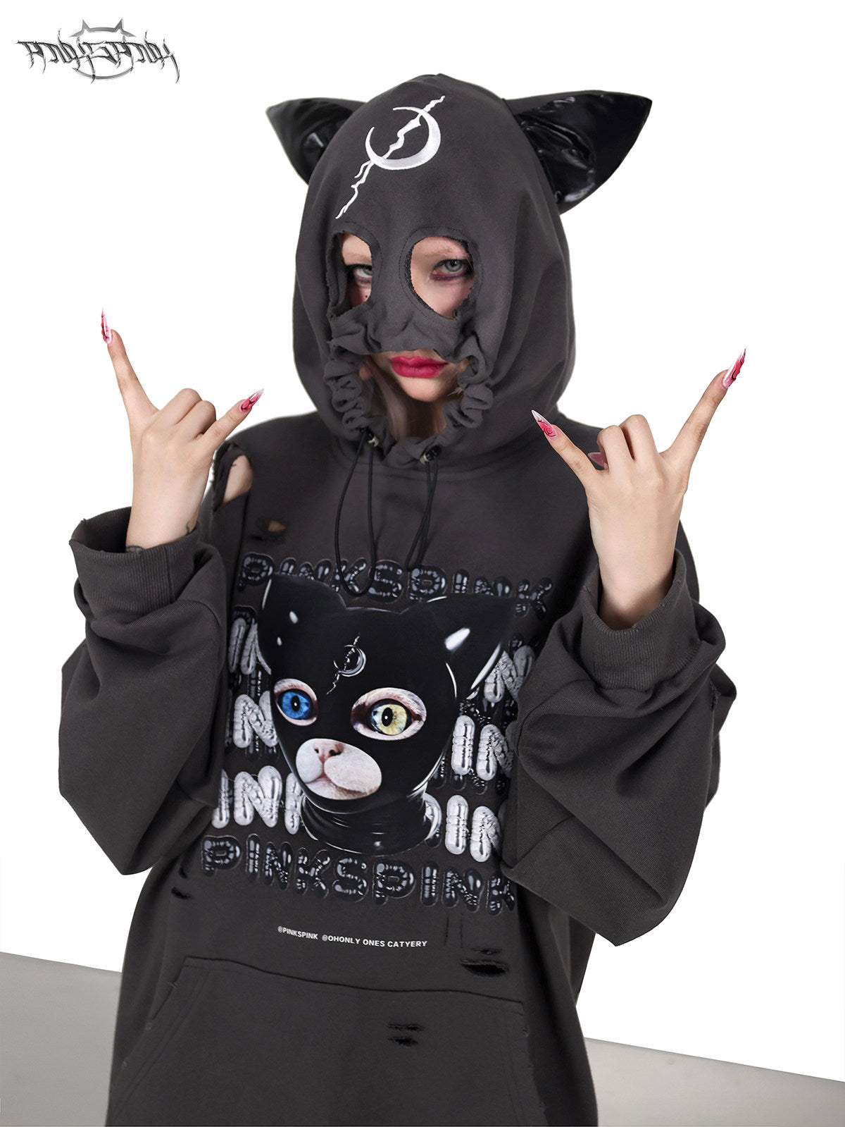 PINKSPINK DEVON CAT distressed mask hoodie in gray — front close-up with the mask hood raised and hands at the temples