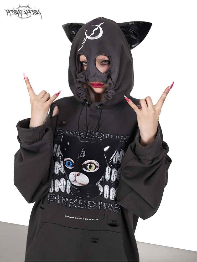 PINKSPINK DEVON CAT distressed mask hoodie in gray — front close-up with the mask hood raised and hands at the temples
