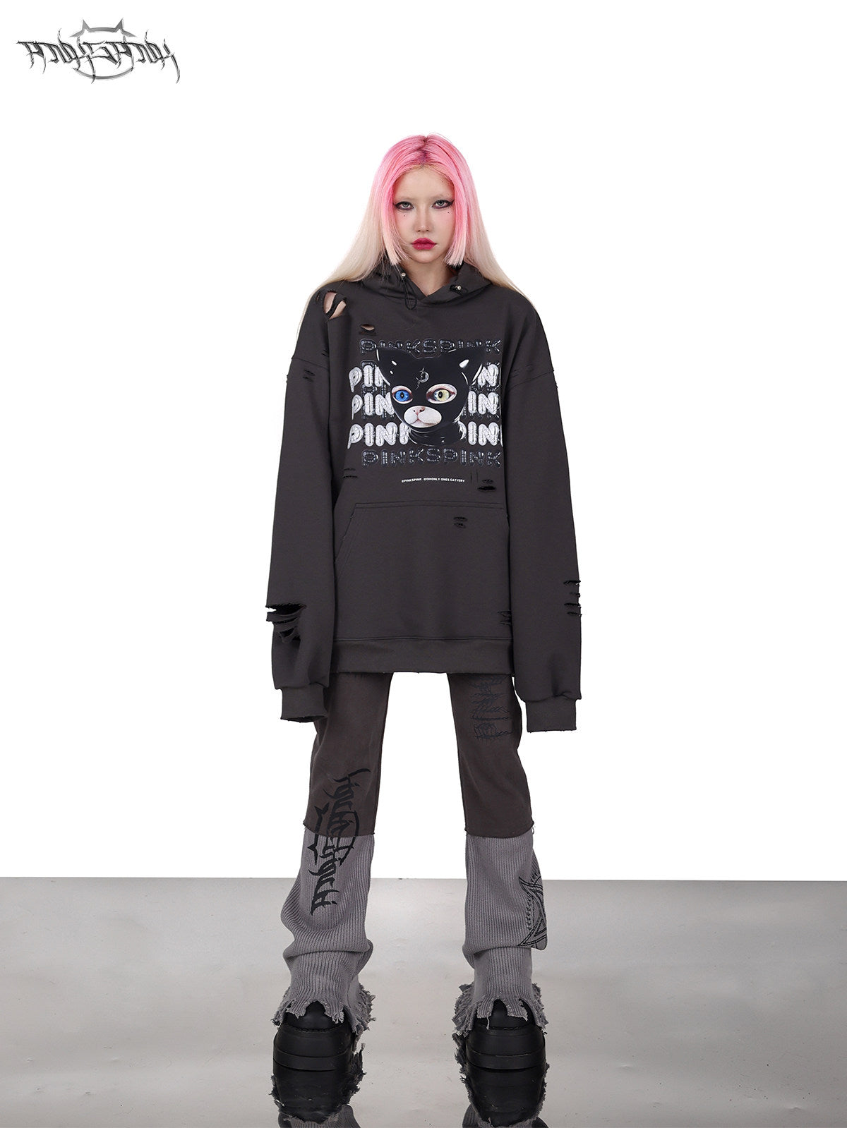 PINKSPINK DEVON CAT distressed mask hoodie in gray — front full-length modeled view styled with gray trousers