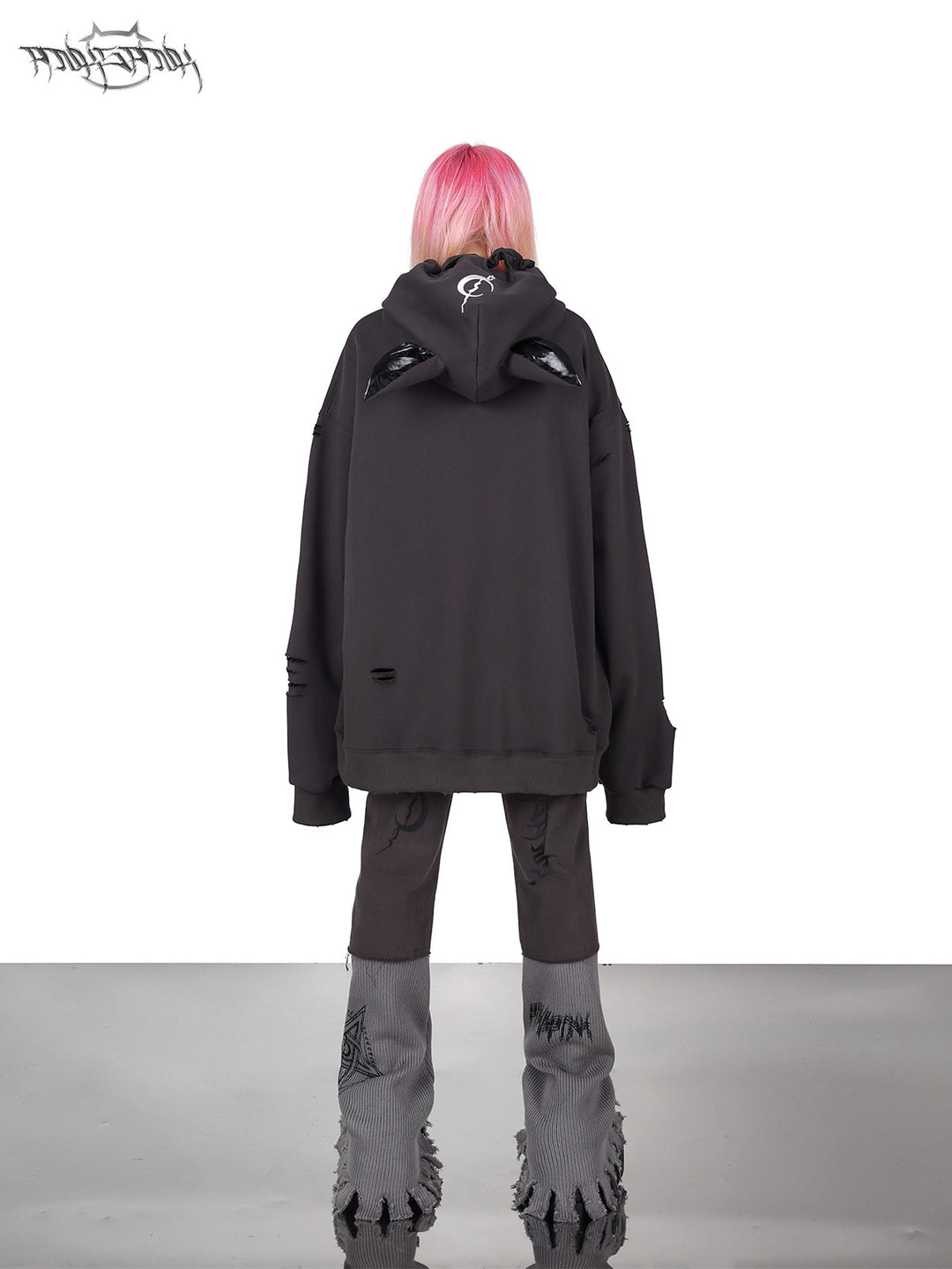 PINKSPINK DEVON CAT distressed mask hoodie in gray — rear full-length modeled view styled with gray trousers