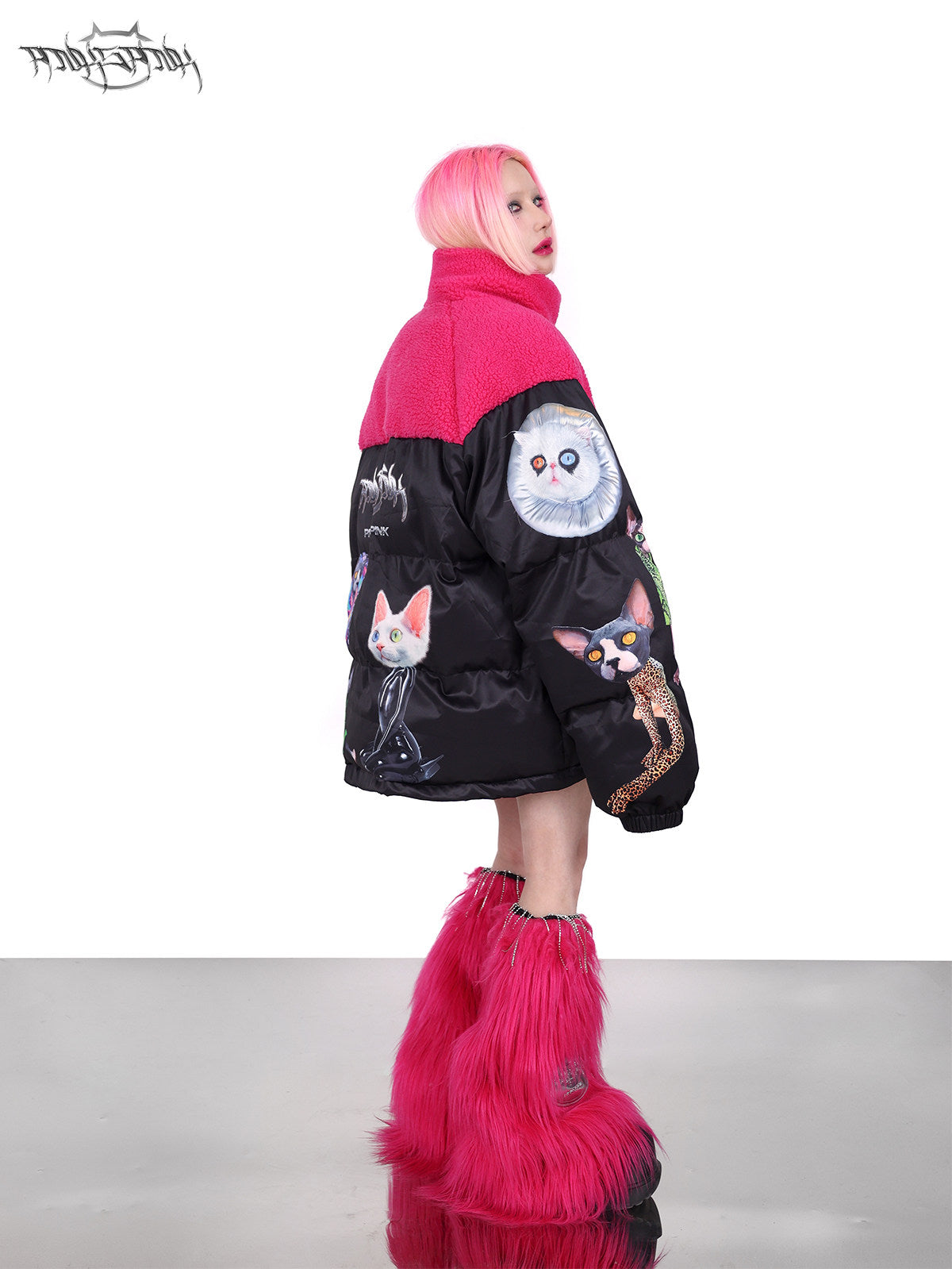 PINKSPINK CAT COSMOS fleece-yoke padded jacket in black pink — rear three-quarter modeled view showing the contrasting fleece yoke