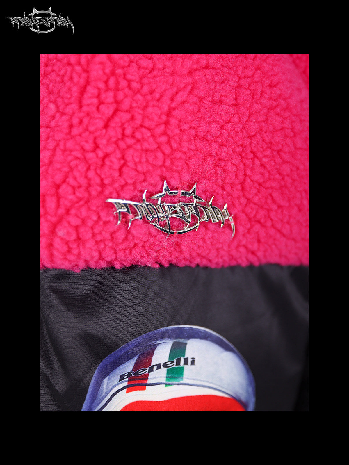 PINKSPINK CAT COSMOS fleece-yoke padded jacket in black pink — close-up of the metallic-look chest logo on pink fleece
