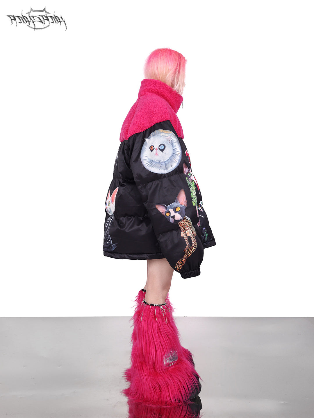 PINKSPINK CAT COSMOS fleece-yoke padded jacket in black pink — right-side full-length modeled view showing the sleeve cat graphics