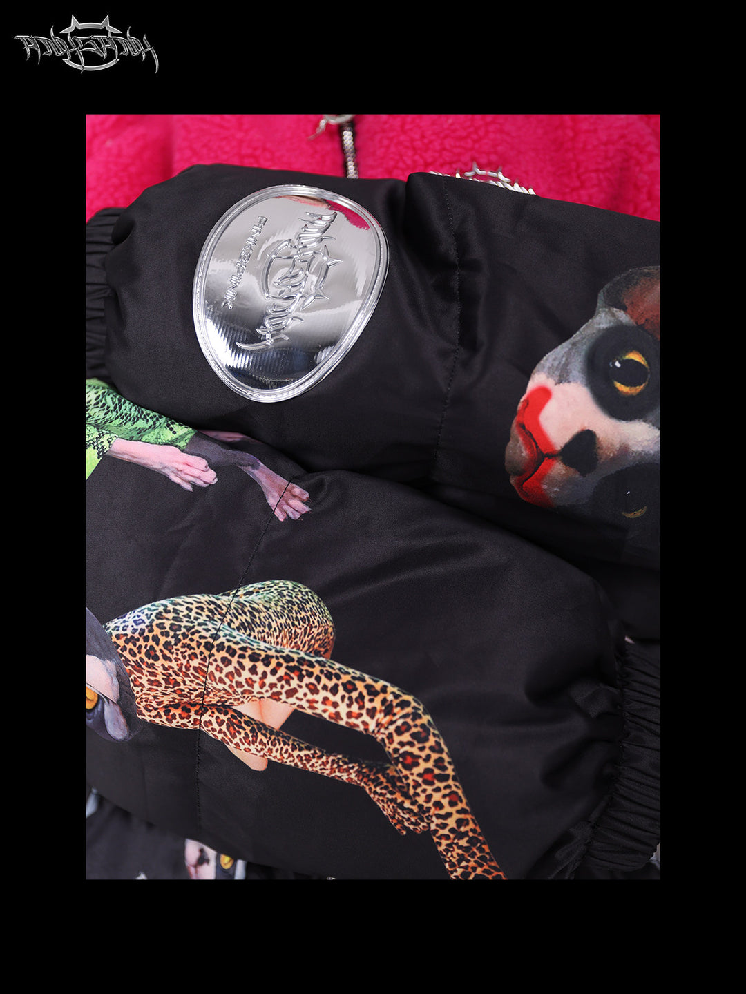 PINKSPINK CAT COSMOS fleece-yoke padded jacket in black pink — close-up of the metallic-look sleeve badge and quilted cat print