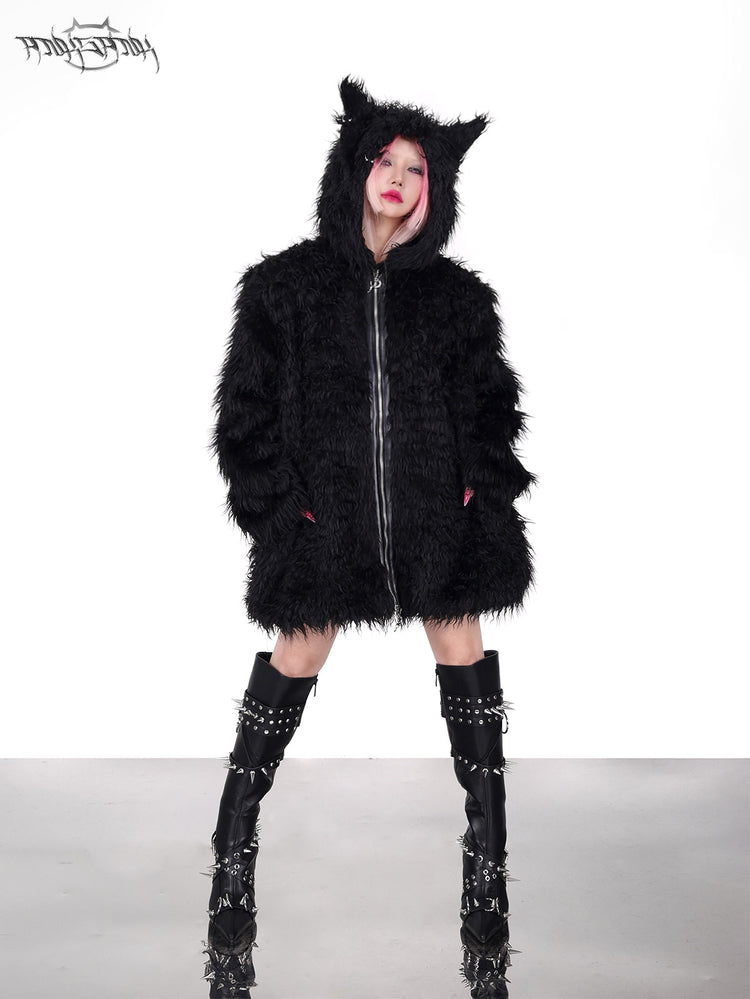 PINKSPINK DEVIL CAT pierced faux-fur jacket in black — front full-length modeled view with hands in the pockets