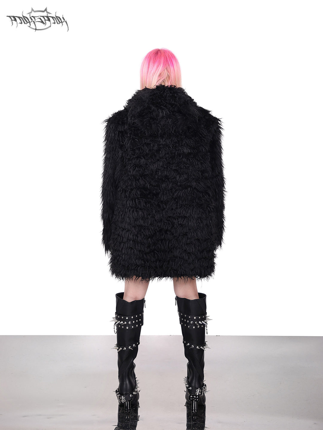PINKSPINK DEVIL CAT pierced faux-fur jacket in black — rear full-length modeled view with the hood down