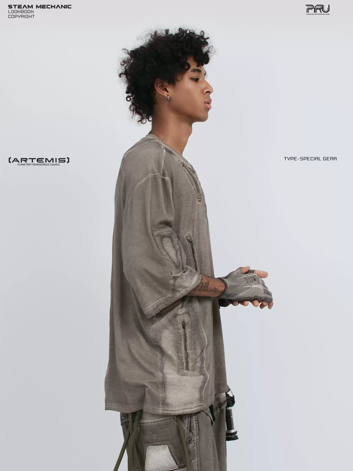 STARCORE xirang brown distressed mesh tee — side close-up with hands clasped