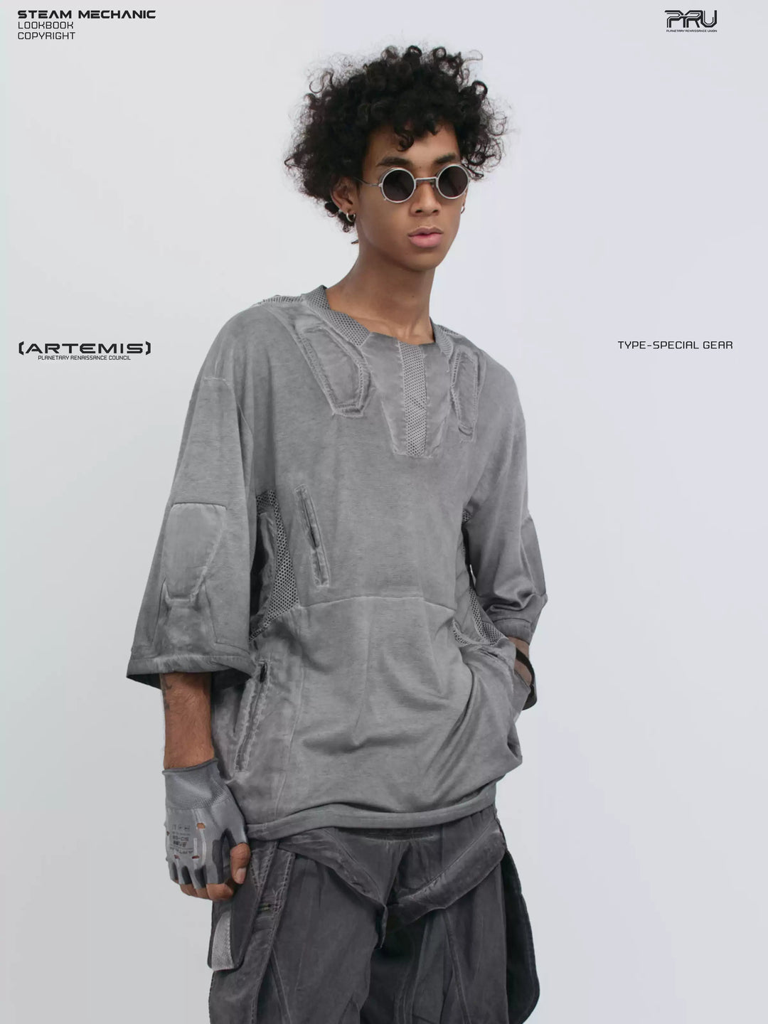 STARCORE moon dust gray distressed mesh tee — three-quarter front close-up with one hand in a pocket