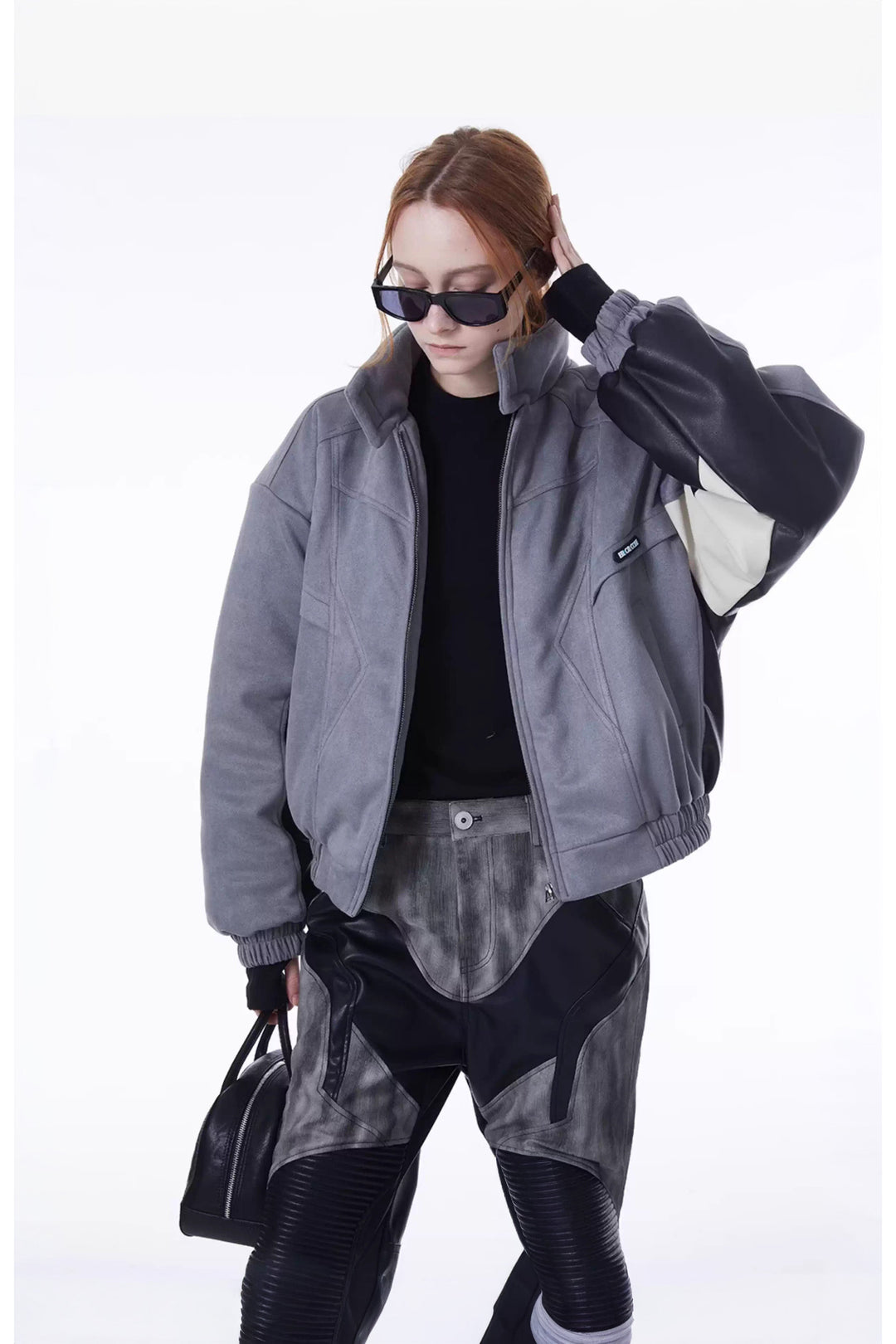 ERRORCODE ROBOT haze-blue contrast-panel padded racing jacket, open-front modeled view with one hand raised