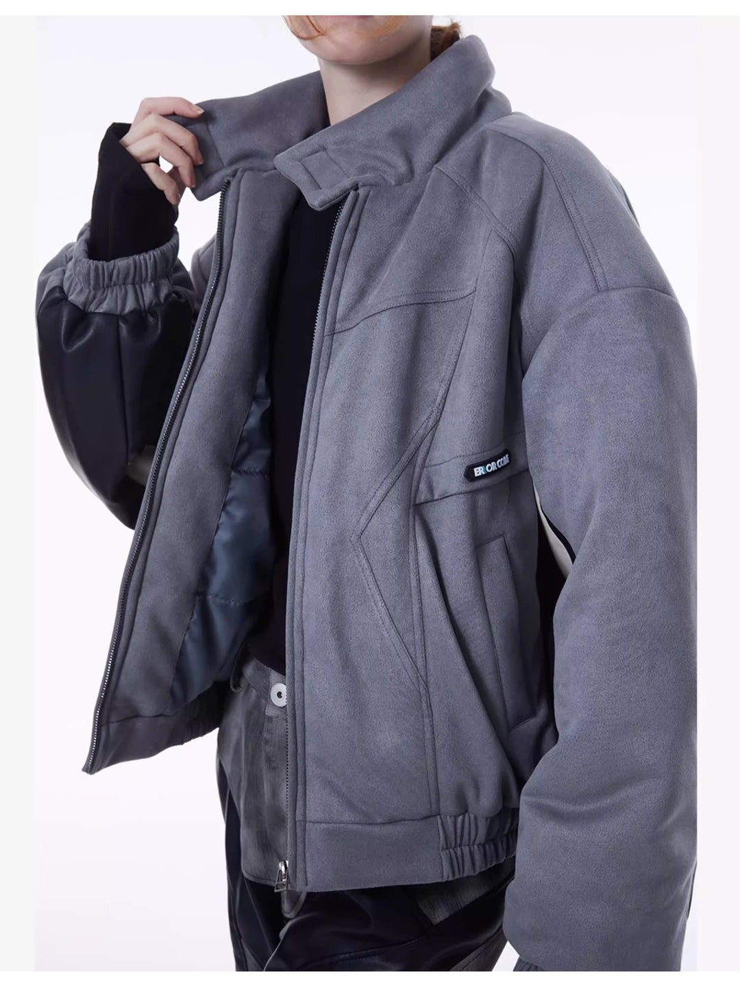 ERRORCODE ROBOT haze-blue contrast-panel padded racing jacket, close-up of the front seam details, zipper and pockets