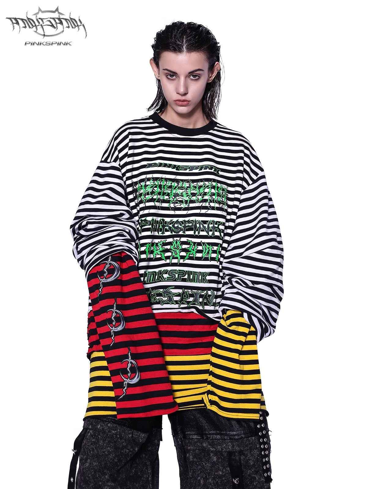 PINKSPINK STACKED STRIPES long-sleeve tee — close-up front view of the green chest lettering and layered striped fabric
