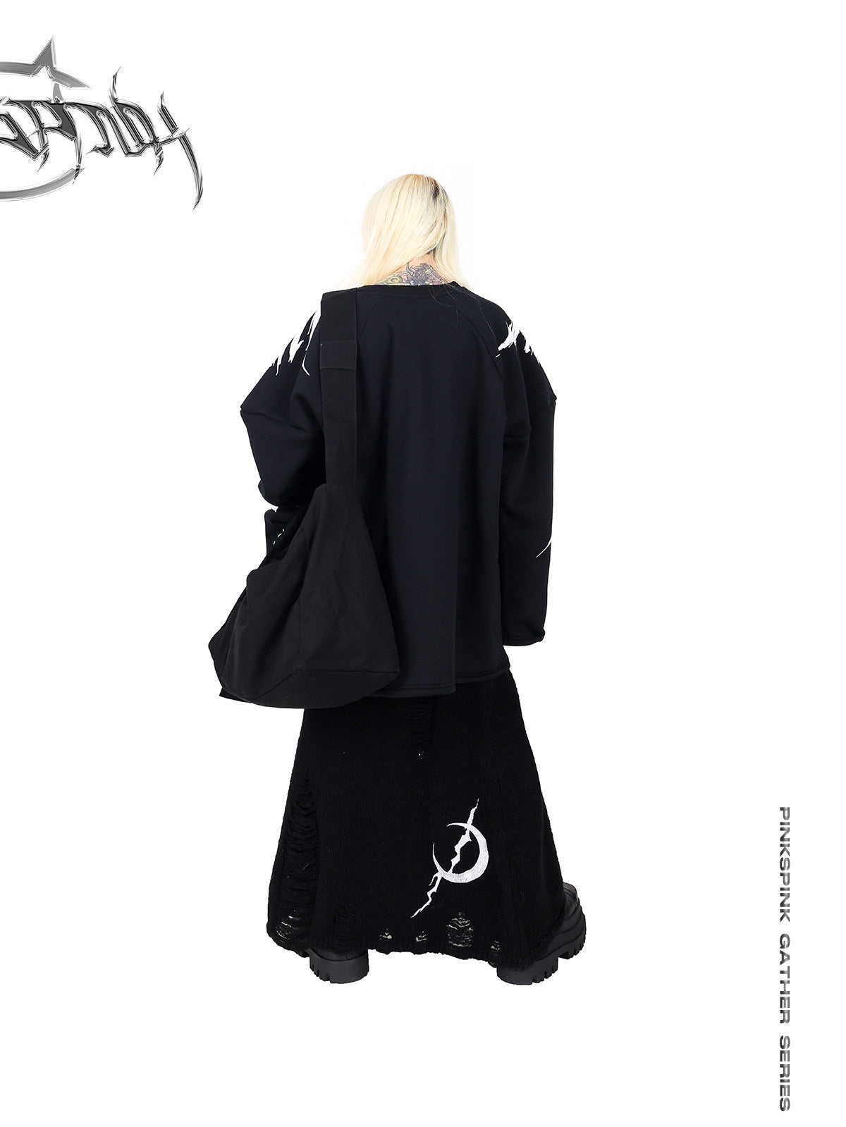 PINKSPINK ELECTRIC MOON black embroidered oversized sweatshirt — rear outfit view with a black skirt and shoulder bag