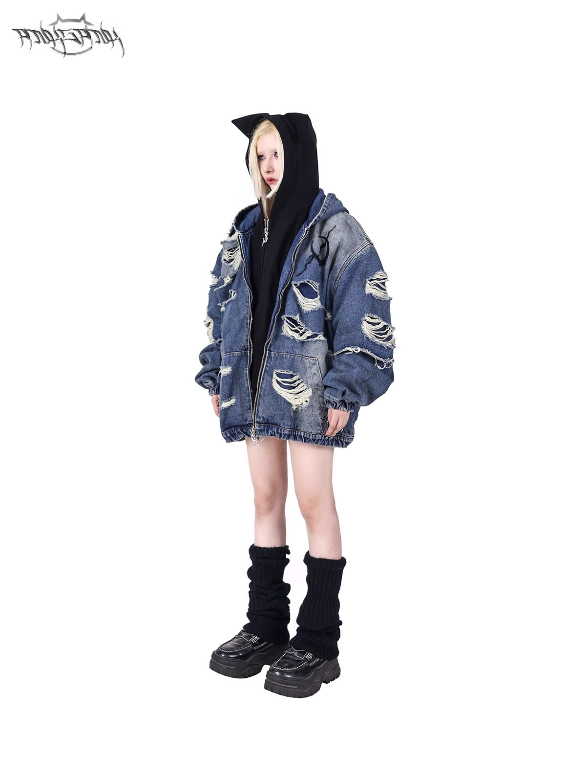 PINKSPINK ELECTRIC MOON double-layer distressed denim jacket in blue — three-quarter front full-length styling view over a black cat-ear hood.