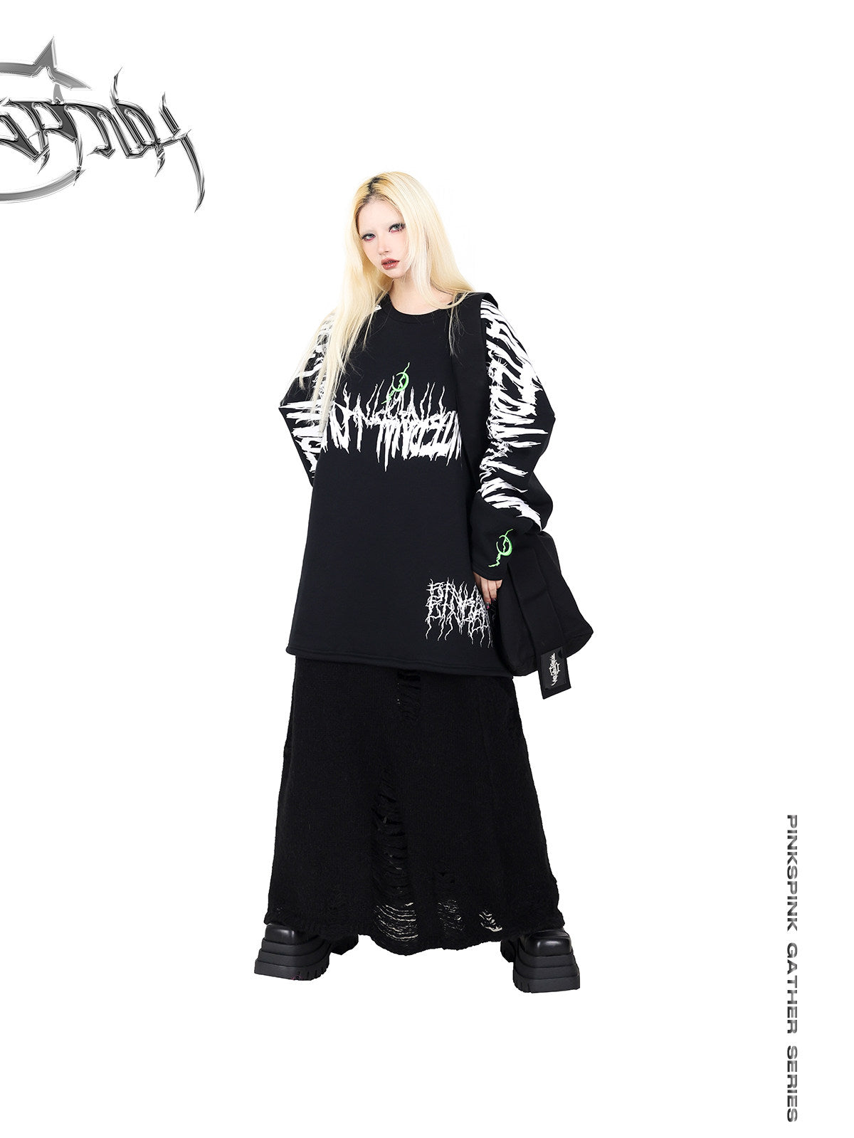 PINKSPINK ELECTRIC MOON black embroidered oversized sweatshirt — angled front styling view with a black skirt and shoulder bag