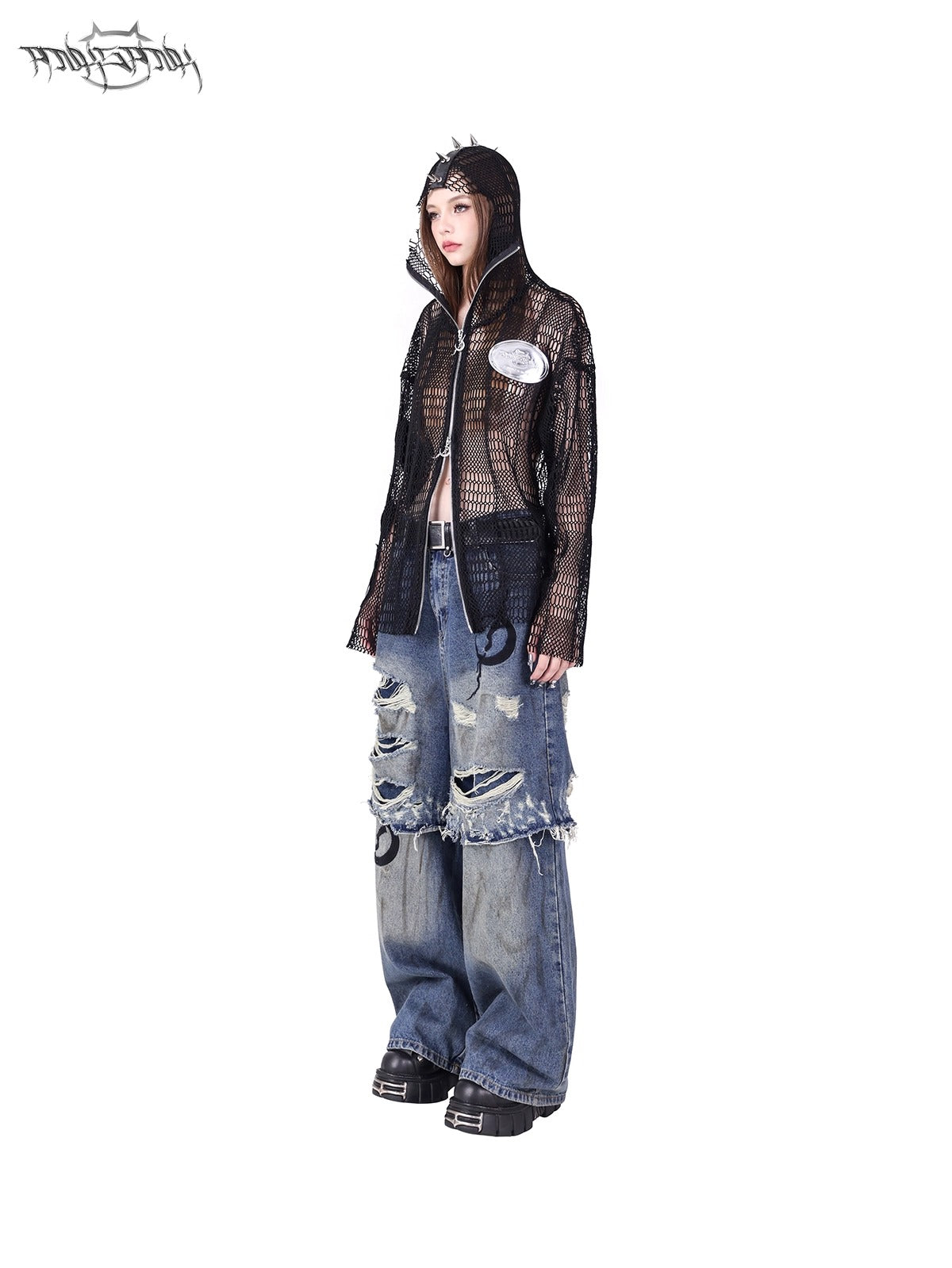 PINKSPINK ELECTRIC MOON double-layer distressed jeans — three-quarter view with a black mesh hooded top