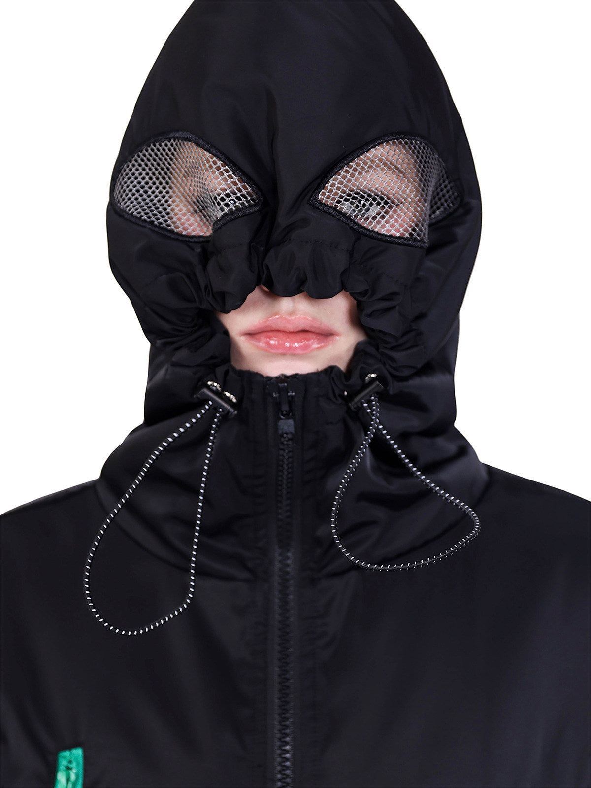 PINKSPINK ALIEN oversized padded zip jacket in black — close-up of the alien-eye hood corresponding to the hero collage