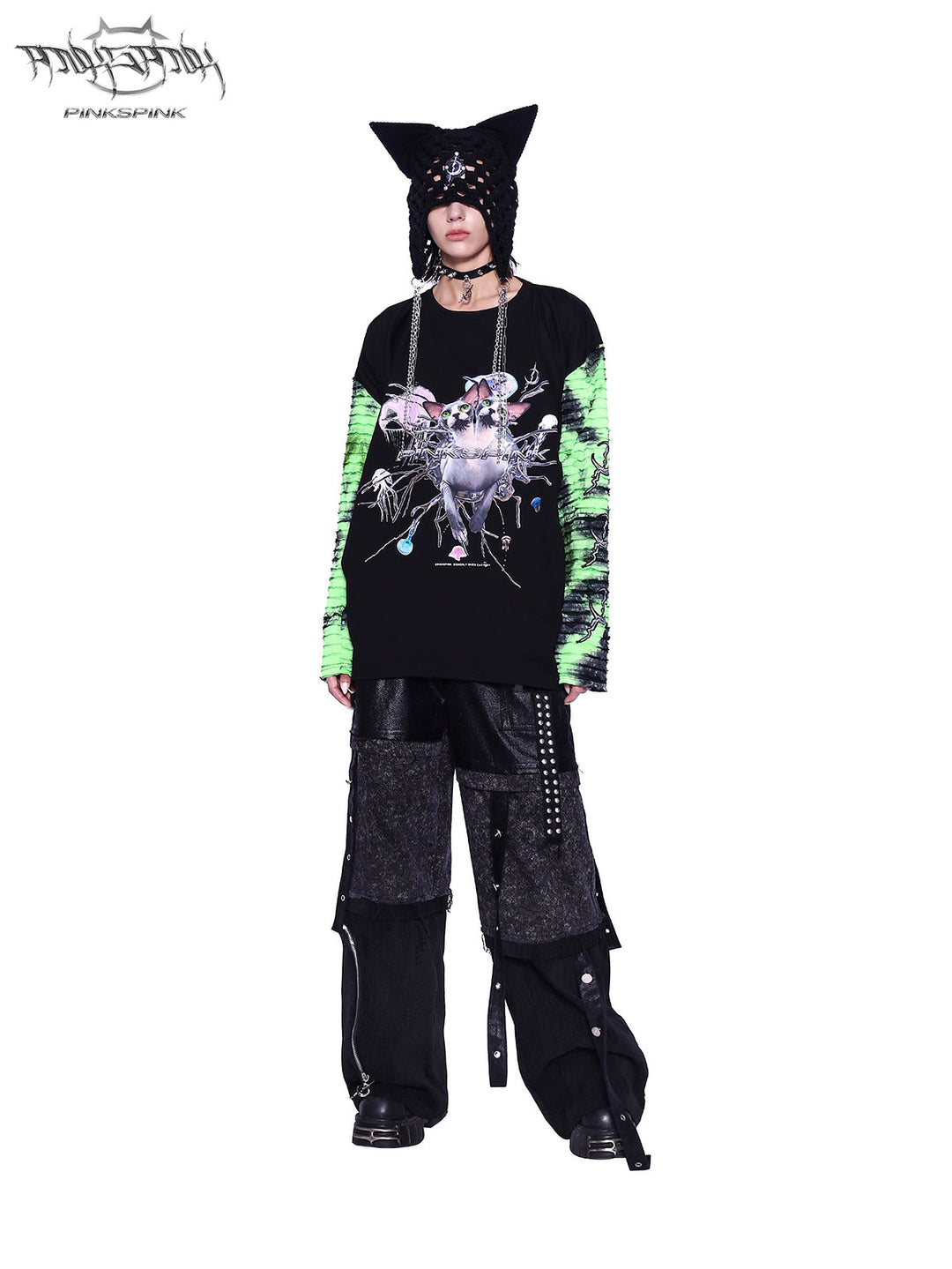 PINKSPINK SPHYNX four-sleeve graphic tee in black green — front full-length modeled view with a separate cat-ear hat and arms lowered