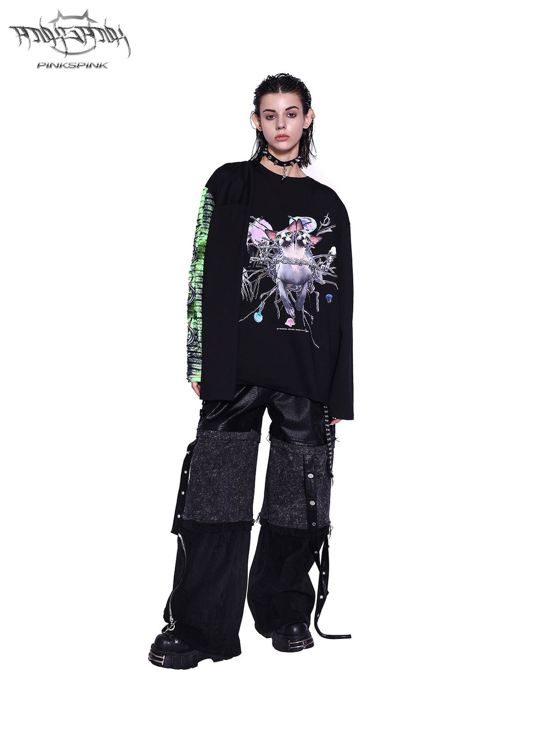 PINKSPINK SPHYNX four-sleeve graphic tee in black green — front full-length modeled view with one green sleeve and one black sleeve worn