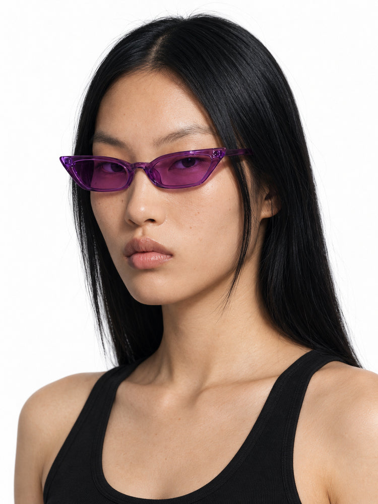MSPACE WIZARD EYES translucent-purple cat-eye sunglasses worn by Chell, three-quarter studio portrait