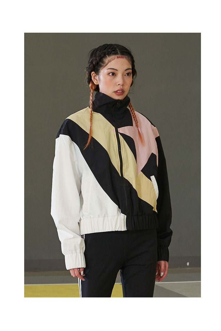 NEXT PASSPORT STAR COLOR BLOCK track jacket, three-quarter styling inside a decorative frame