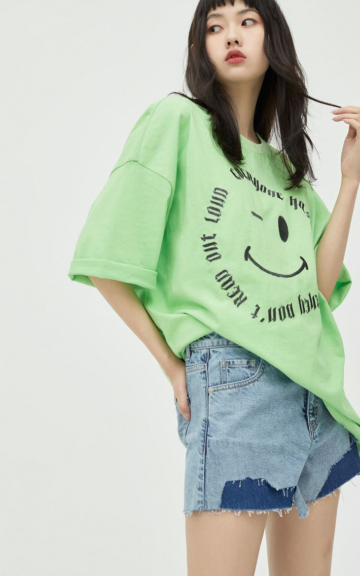 ONLY PAPER TEAR patchwork denim shorts, blue, close front outfit with a green tee