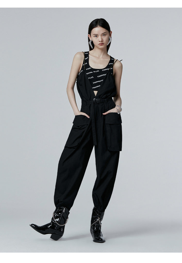 SHOWROOM PLUS HACKWRENCH UTILITY convertible jumpsuit, black, standing pose with hands in pockets