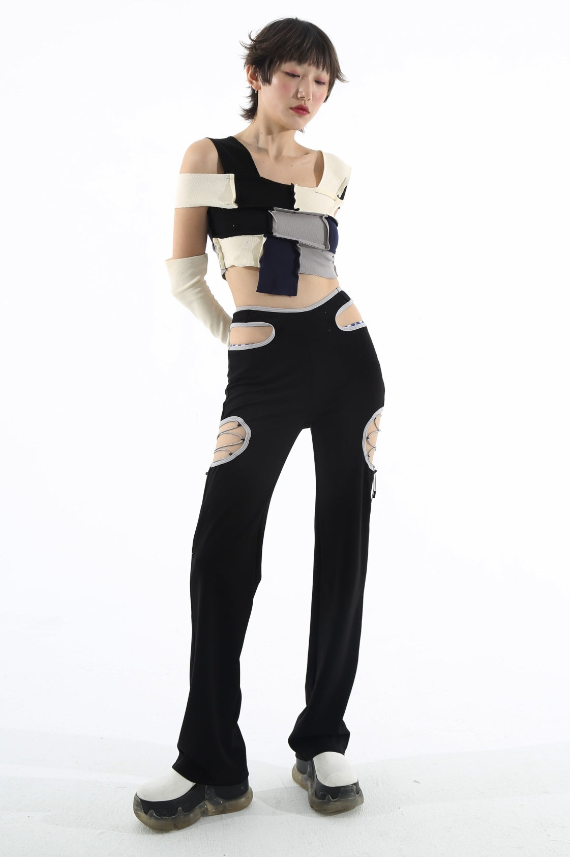NEXT PASSPORT RETROFUTURE cutout pants, studio front outfit showing the long wide legs