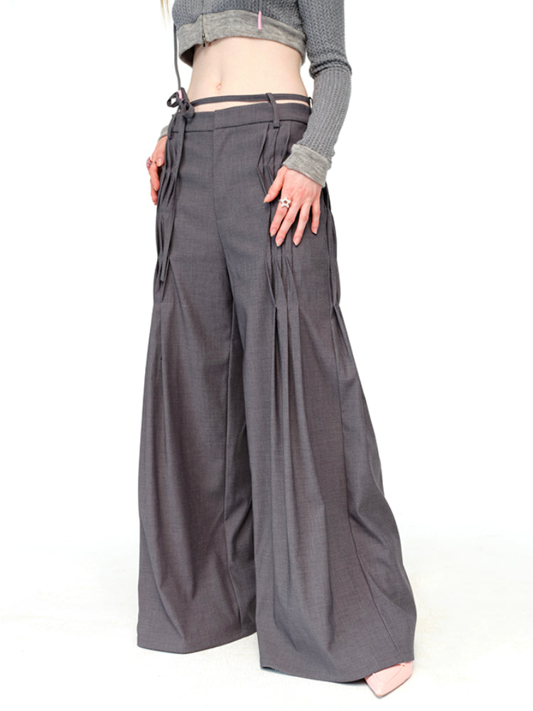 NEXT PASSPORT gray trousers close-up showing waist tie, belt loops and deep pleats
