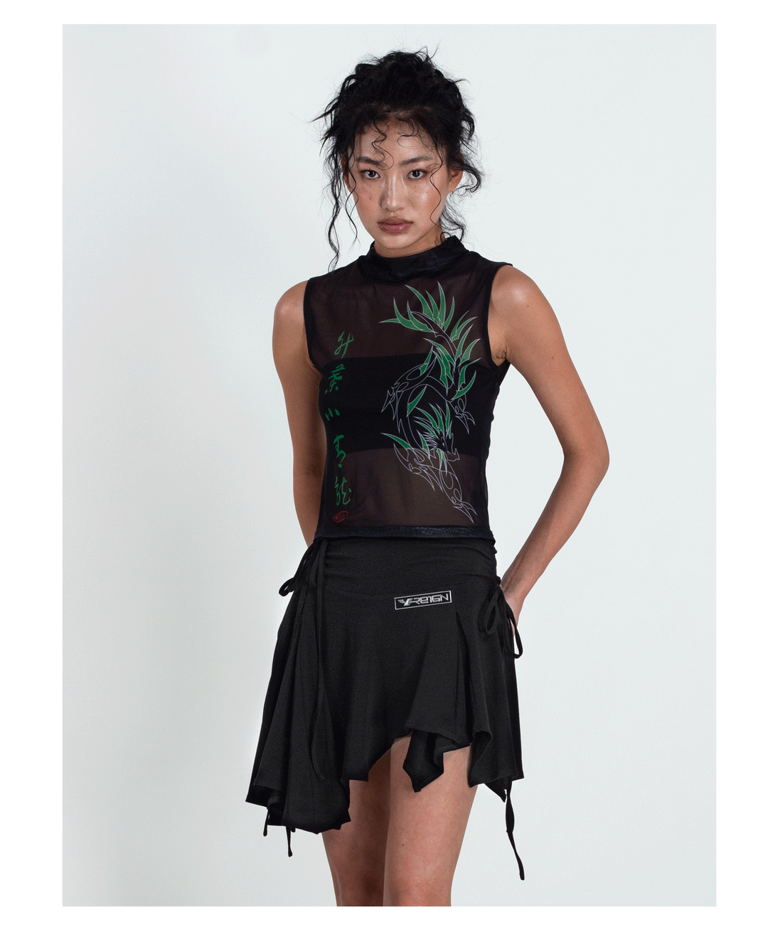 4RE1GN BAMBOO DRAGON sleeveless mesh vest, front styling with a black skirt