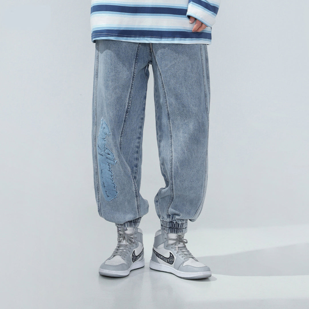 BJHG EMBROIDERED loose denim joggers, front styling with a striped top